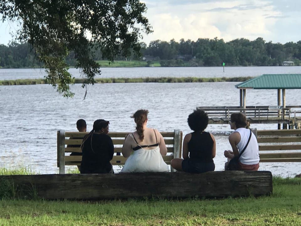 Youth sitting in front of the water